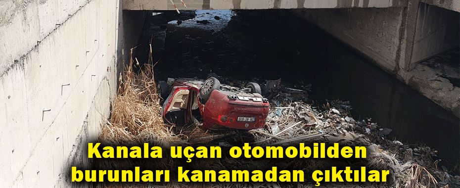 Kanala uçan otomobilden burunları kanamadan çıktılar